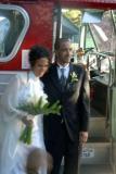 The 'just marrieds' by the wedding bus