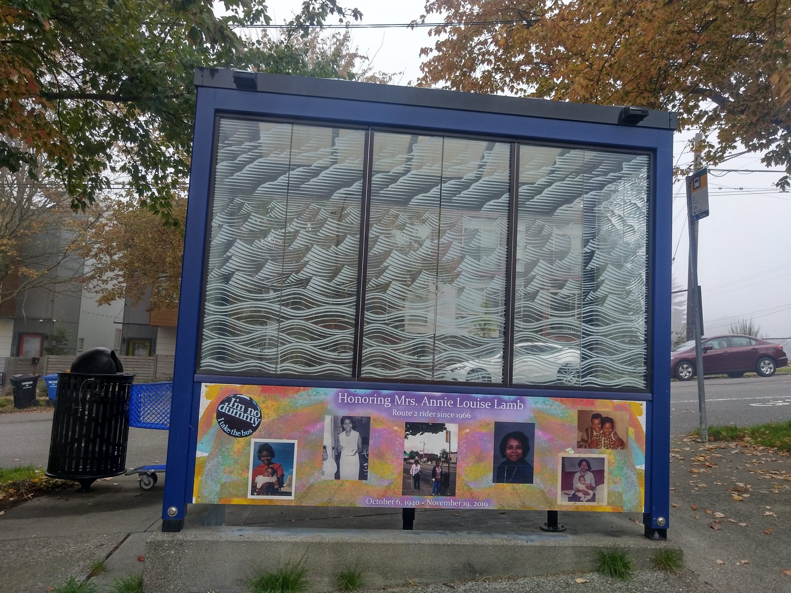 A bus shelter with a mural honoring Annie Lamb