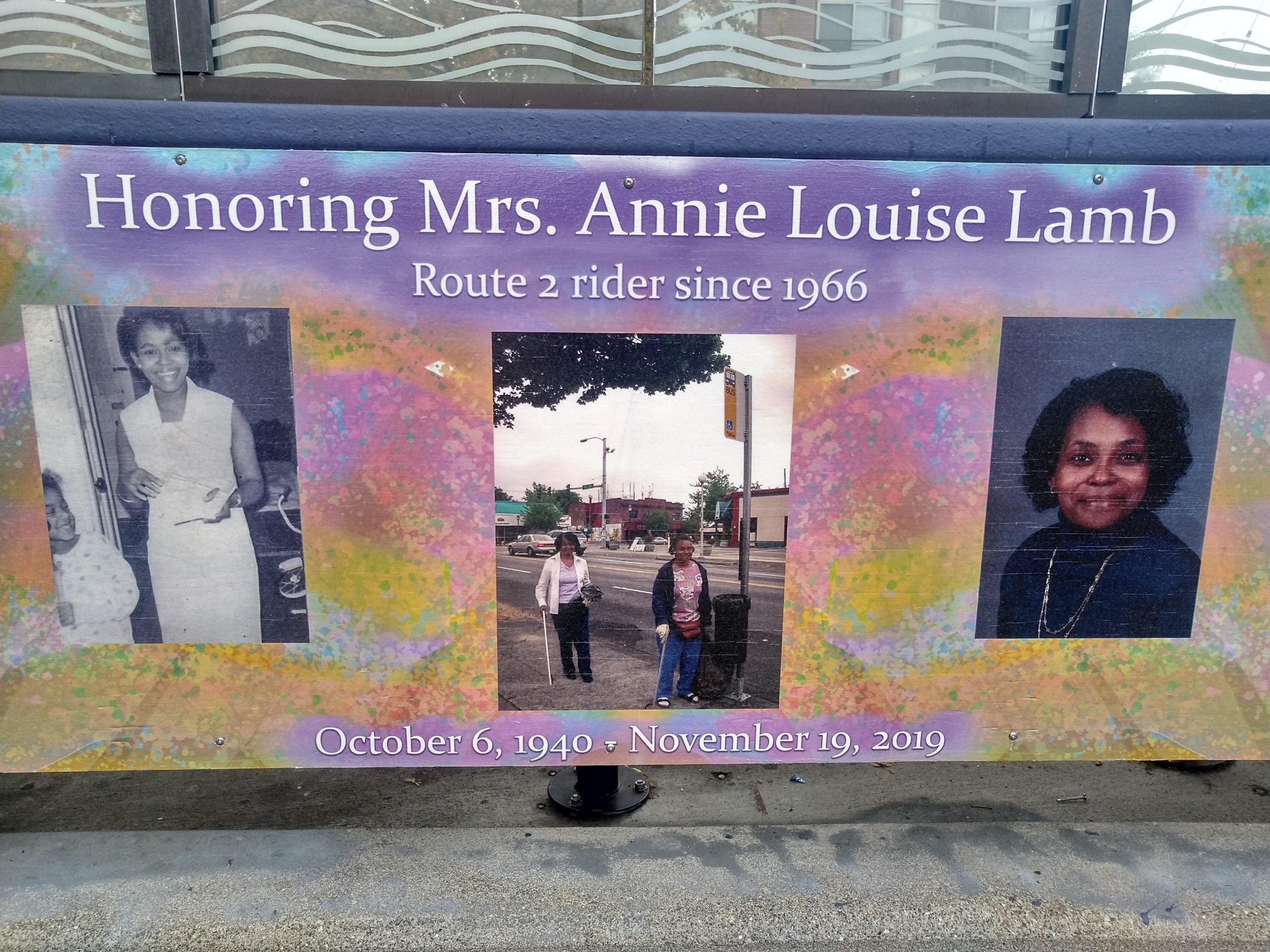 A bus shelter with a mural honoring Annie Lamb